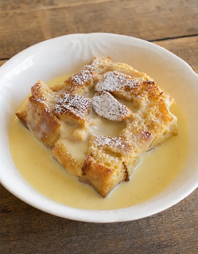 Classic Bread Pudding with Vanilla Sauce prepared dish